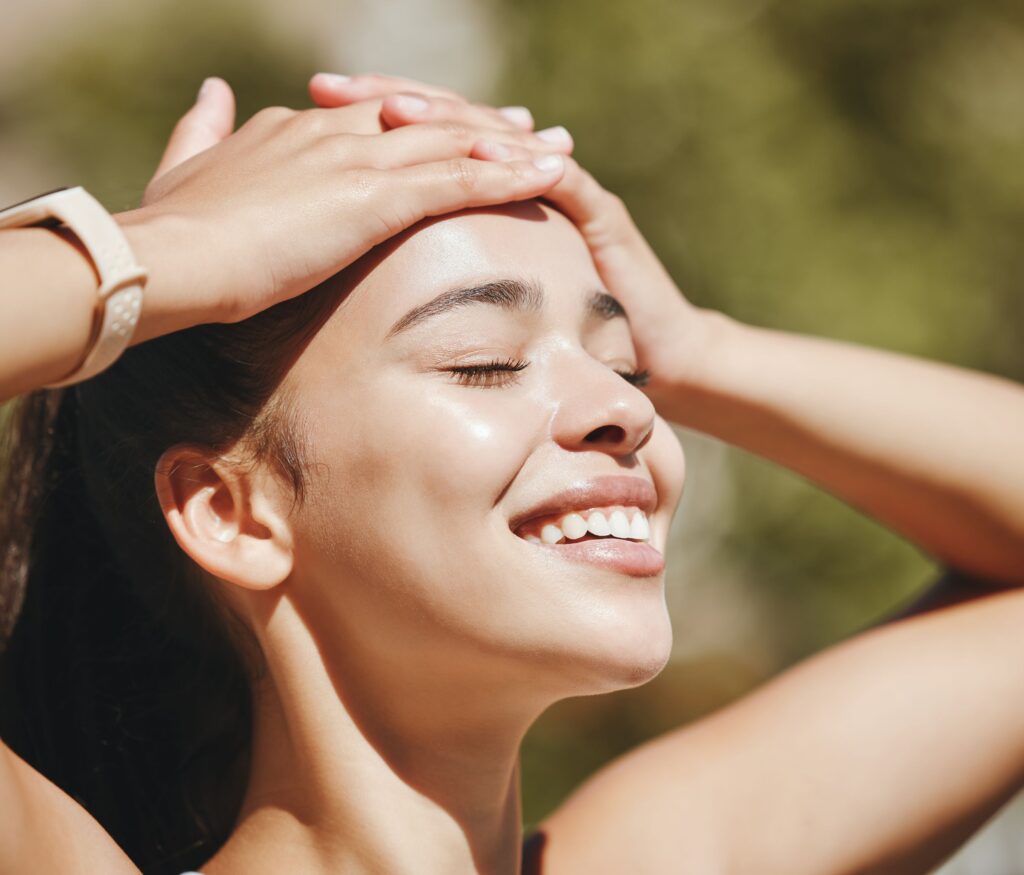 close up shot of a woman outdoor with perfect skin