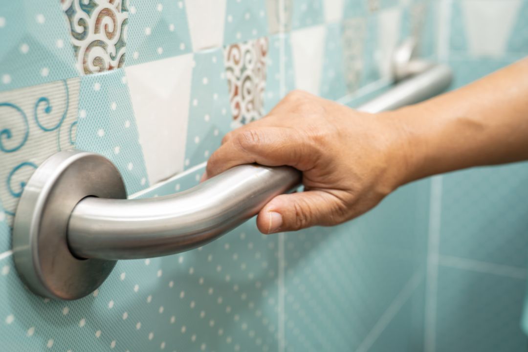 what not to do after iv drip. Asian elderly woman use toilet bathroom handle security, healthy strong medical concept.