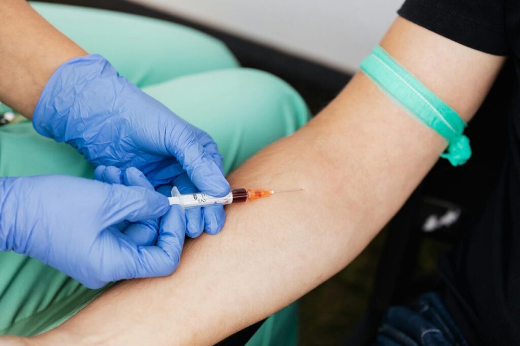 a person getting a vitamin b12 shot from a healthcare personnel