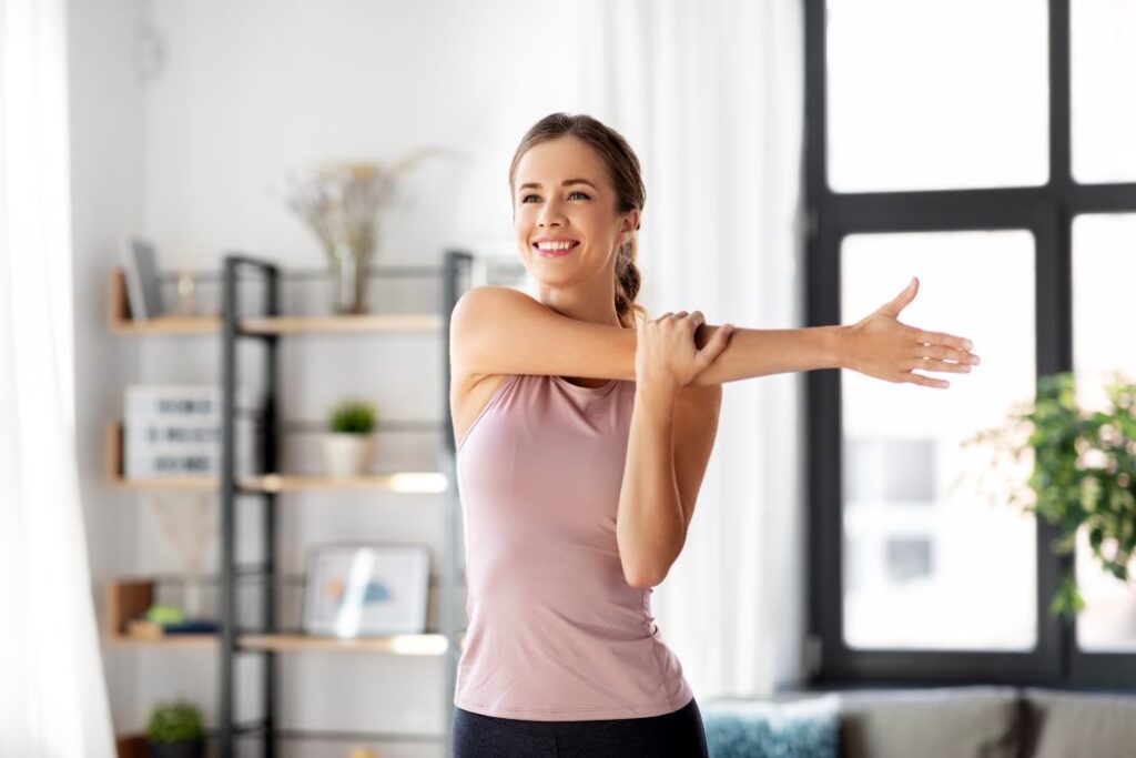 woman doing stretches at the living room 